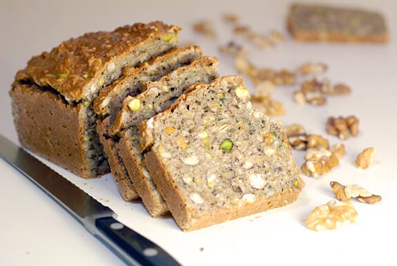 Sharing loaf of bread with saw stock photo